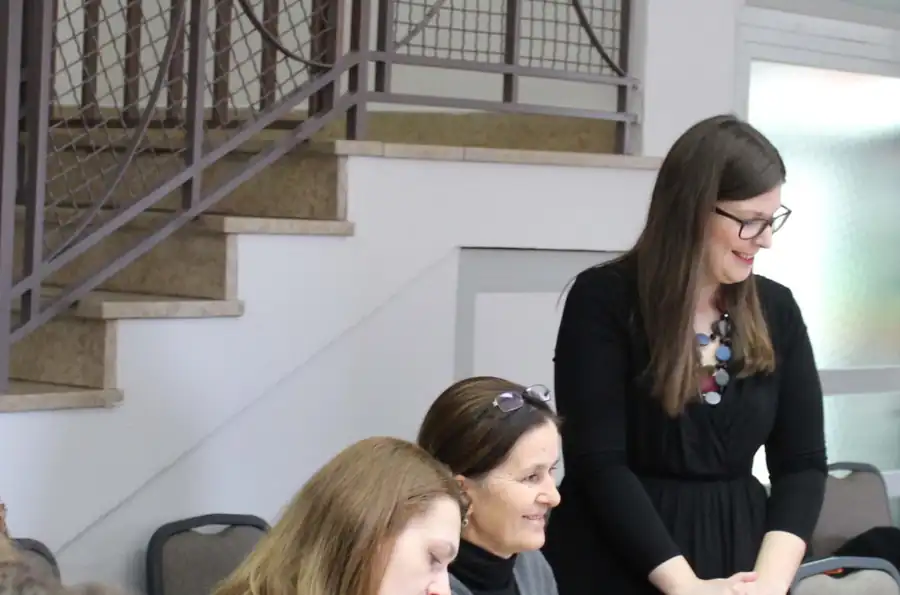 Laura Plantak leading a workshop with a group of business owners
